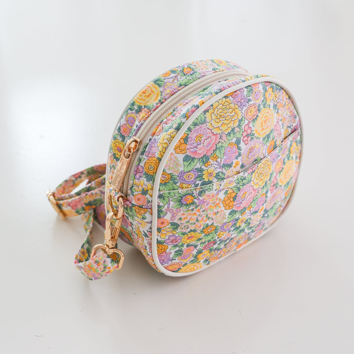 Josie Joan's Audrey round crossbody bag in Liberty London fabric