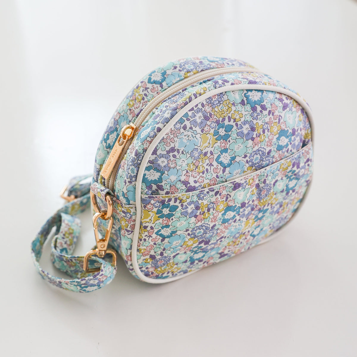 Josie Joan's Suzanne round crossbody bag in Liberty London fabric