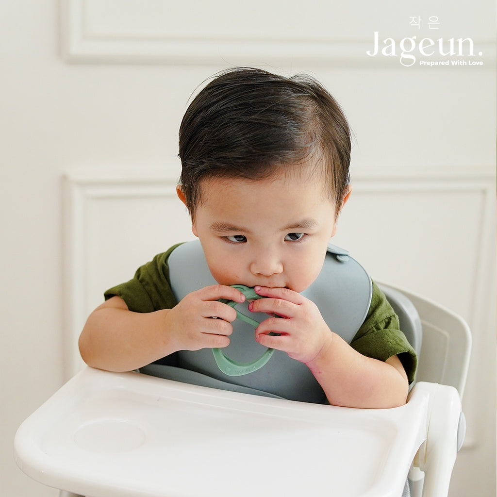 Baby wearing the elephant teether on his hand