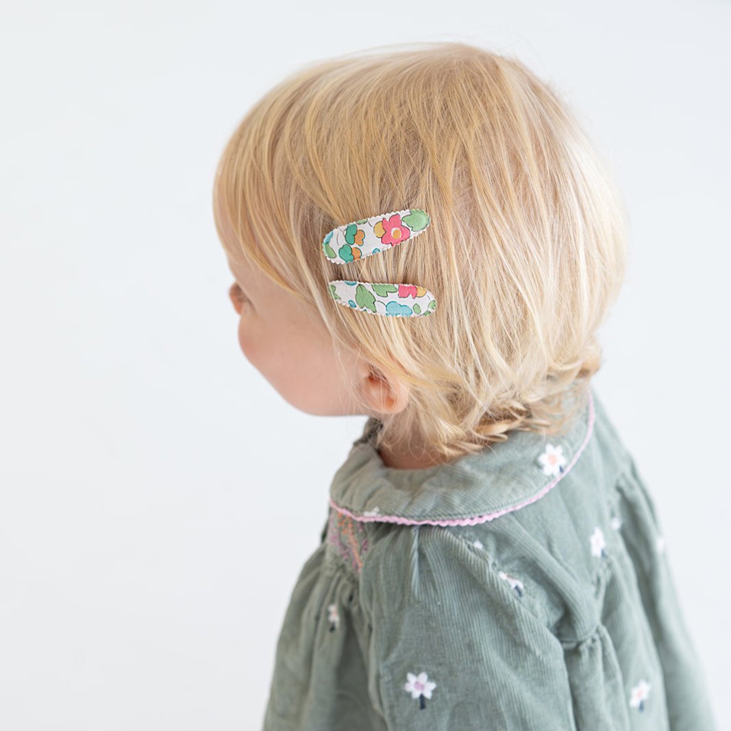 Side view of toddler wearing Josie Joan's Little Kylie hair clips