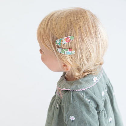 Side view of toddler wearing Josie Joan's Little Kylie hair clips