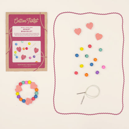 Heart bracelet kit contents with wooden heart beads and elastic