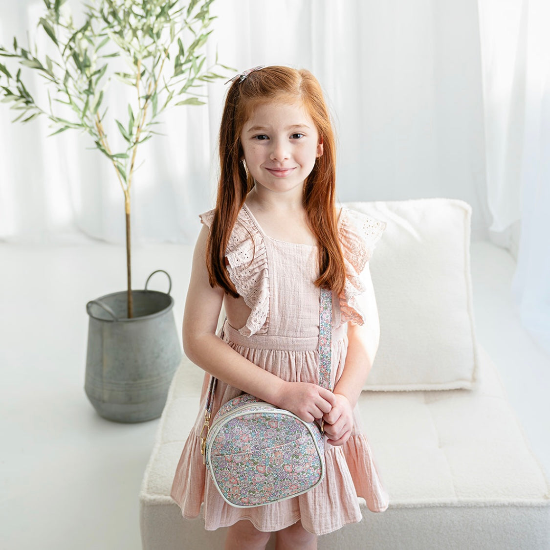 Girl wearing the Lillia crossbody bag across her body