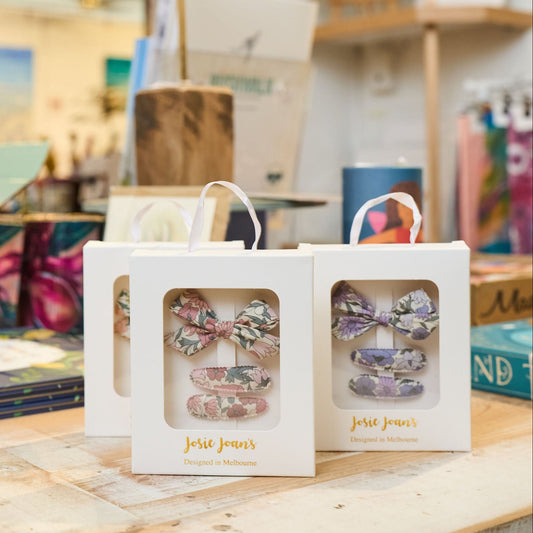 Josie Joan's small gift boxes displayed on a shelf