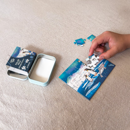 Child piecing together the Polar Pals mini jigsaw puzzle