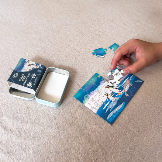 Child piecing together the Polar Pals mini jigsaw puzzle