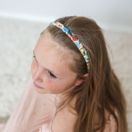 Girl wearing the Lauren Alice headband