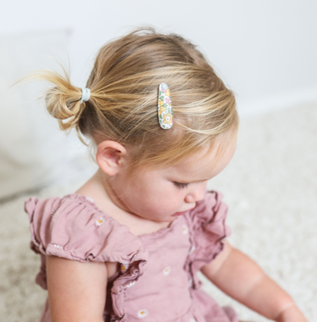 Toddler wearing Josie Joan's Little Sophie hair clip in pigtails