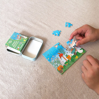 Child piecing together the Spring Meadow mini jigsaw puzzle