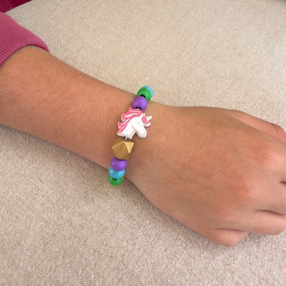 Child wearing a unicorn bead bracelet made with the Cotton Twist Unicorn Beading Kit