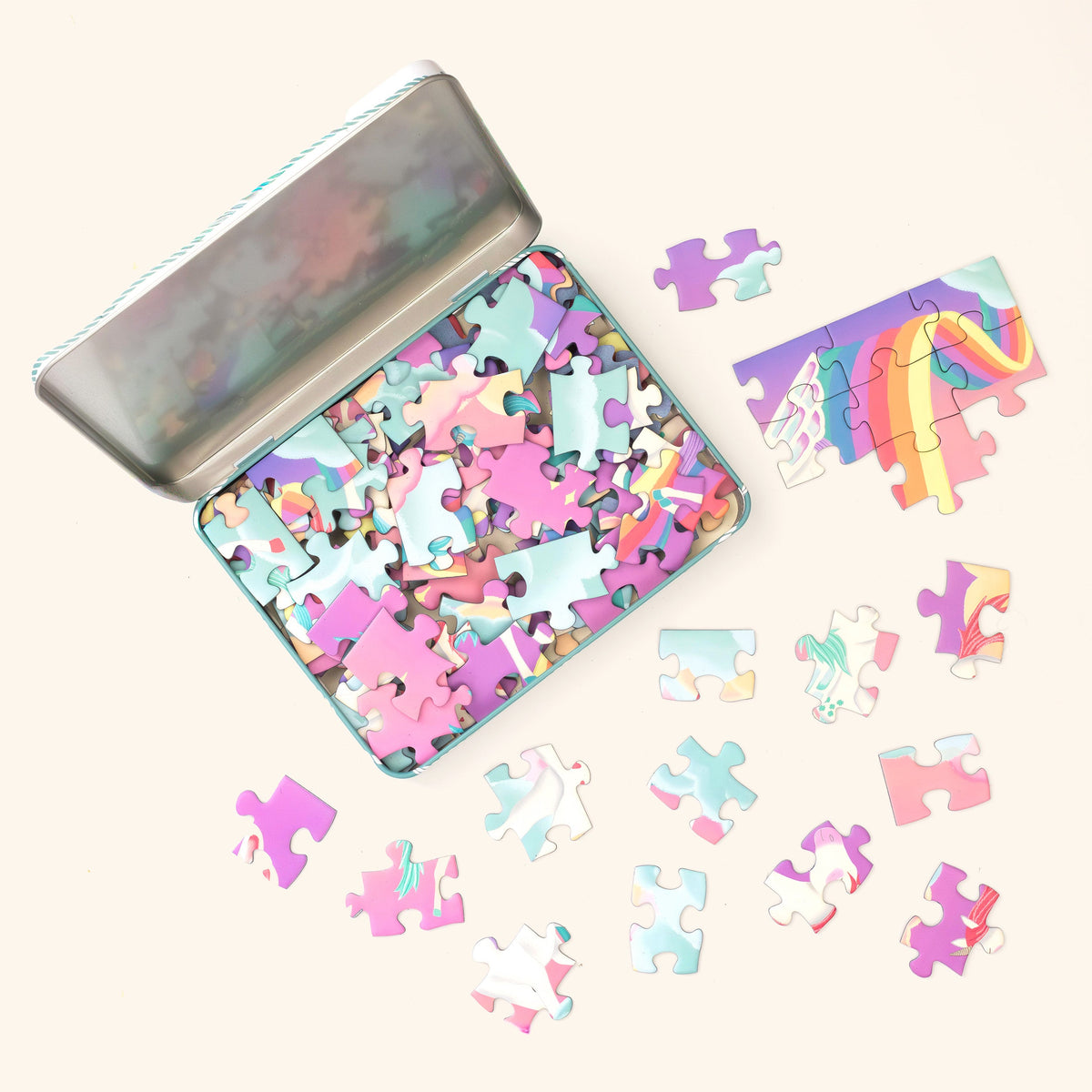 Unicorn Dreamland jigsaw pieces in the open tin